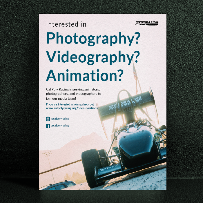 A poster advertising open positions for photographers, videographers, and animators leaning against a dark green wall.
