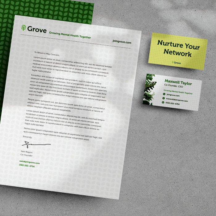 A the front and back of a business card and a formal letter with the Grove branding.