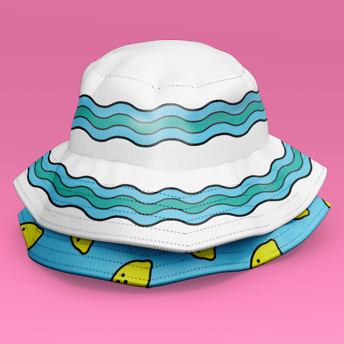 Two bucket hats stacked on top of each other. One has the water graphic circling the brim and band, the other is bright blue with a pattern of simple lemon icons.